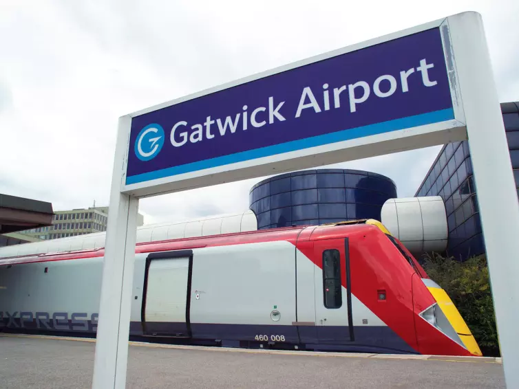 Gatwick Express train in station, Gatwick Airport sign.