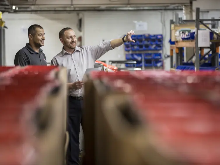 workshop-supervisor-showing-operator.