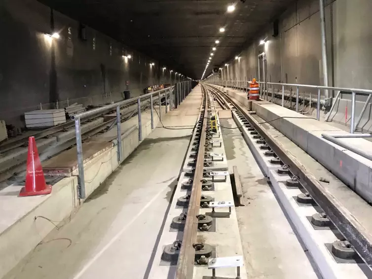 rail fasteners on track in subway tunnel.